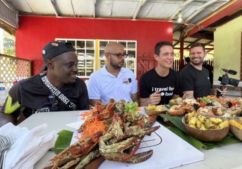 Mark Wiens with Foodie Tales with Zaak, Raymond Edwards, Trini Surfer on the Totally Toco tour experience in Trinidad and Tobago at Aunty Kay's in Balandra
